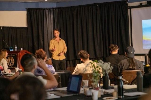 A speaker addressing the room during a workshop at the Future Proof Creator Summit 2026