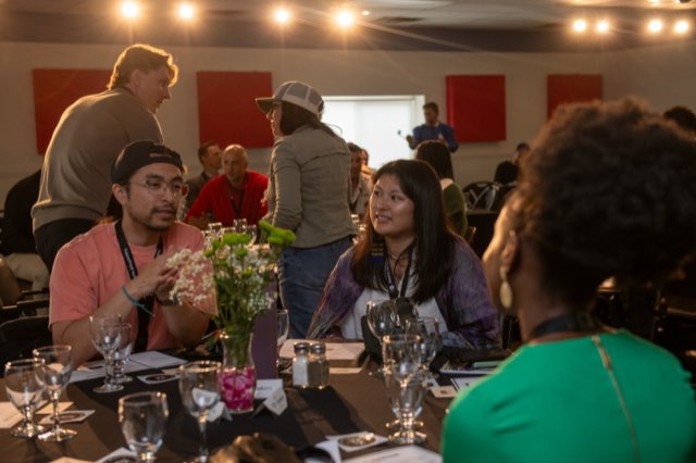 Attendees deep in conversation at a roundtable during the Future Proof Creator Summit 2026