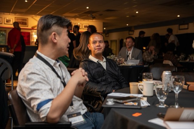 Attendees in conversation at a dinner table at the Future Proof Creator Summit 2026