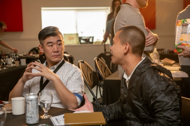 Two attendees in conversation at the Future Proof Creator Summit 2026