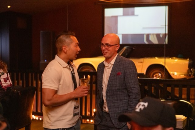 Two attendees in conversation at an evening event during the Future Proof Creator Summit 2026