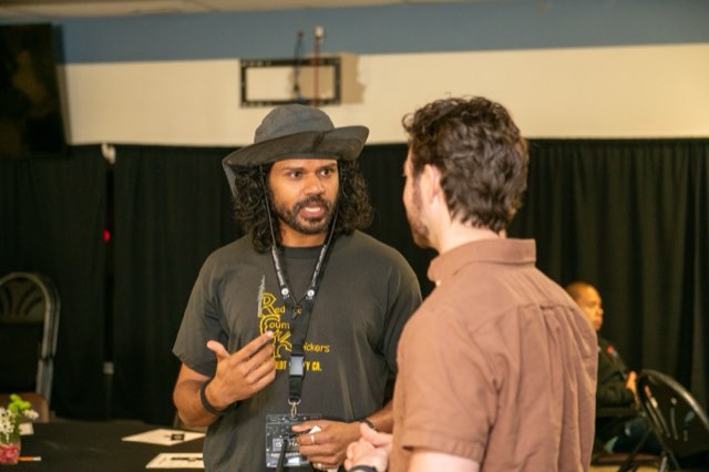 Two attendees in conversation at the Future Proof Creator Summit 2026