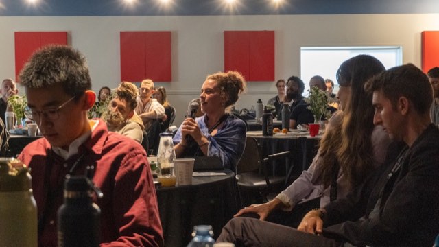 Lily Alexandra asking a question during a Q&A session at the 2026 summit