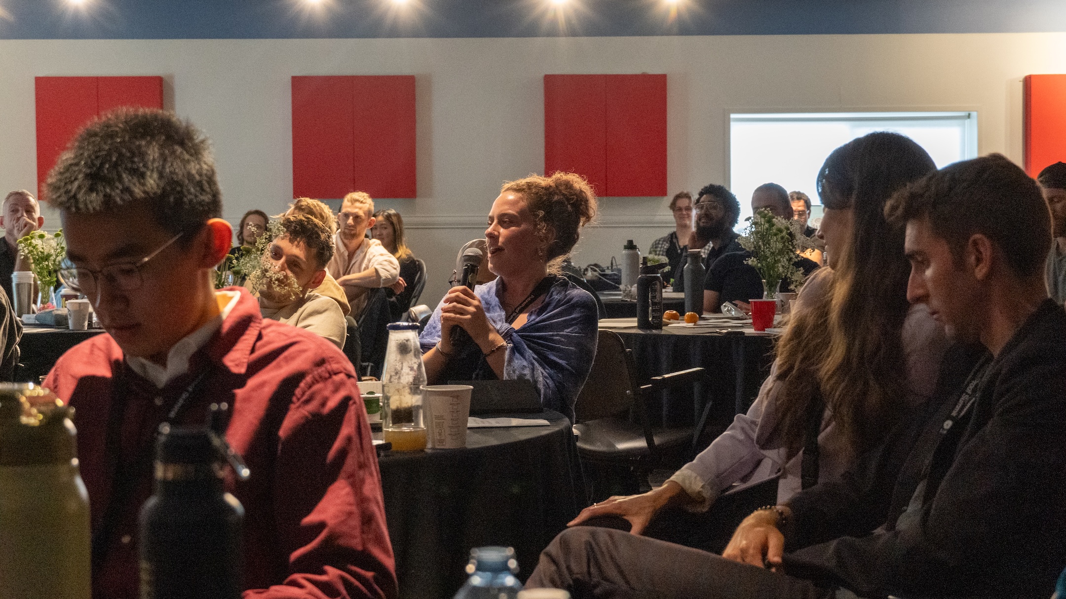 The audience listening during a session at the 2026 summit